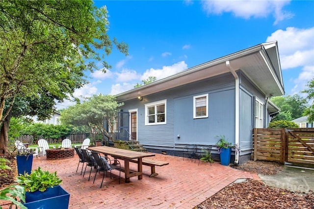 128 E 48th St, Savannah, GA 31405 - back of house featuring an outdoor fire pit and a patio