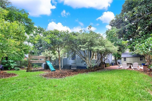 128 E 48th St, Savannah, GA 31405 - view of yard featuring a playground and a patio area