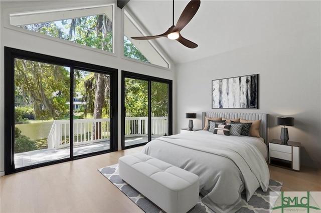 bedroom with wood finished floors, a ceiling fan, high vaulted ceiling, beam ceiling, and access to outside