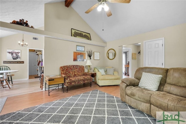 living area featuring high vaulted ceiling, wood finished floors, ceiling fan with notable chandelier, beam ceiling, and visible vents