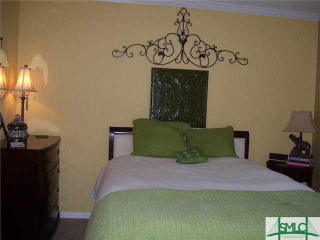 bedroom featuring baseboards and ornamental molding