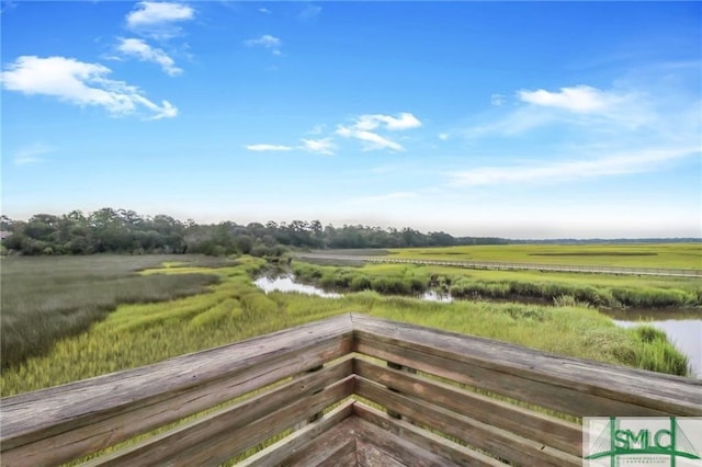 wooden deck featuring a rural view