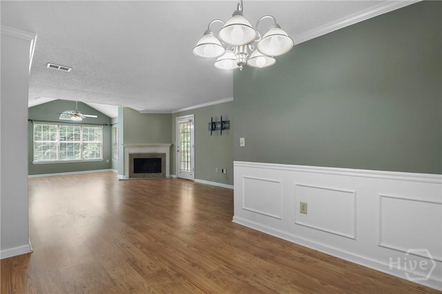 12300 Apache Ave Unit 1212, Savannah, GA 31419 - unfurnished living room featuring ornamental molding, a chandelier, ceiling fan, a fireplace, and wood finished floors