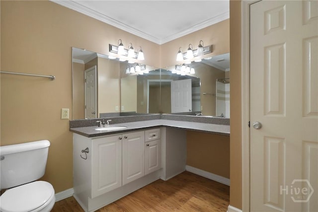 12300 Apache Ave Unit 1212, Savannah, GA 31419 - full bathroom featuring crown molding, toilet, vanity, wood finished floors, and baseboards