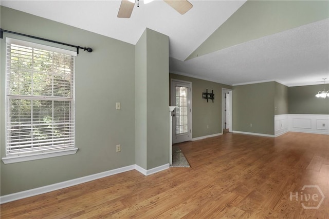 12300 Apache Ave Unit 1212, Savannah, GA 31419 - spare room with wood finished floors, a ceiling fan, vaulted ceiling, crown molding, and a chandelier