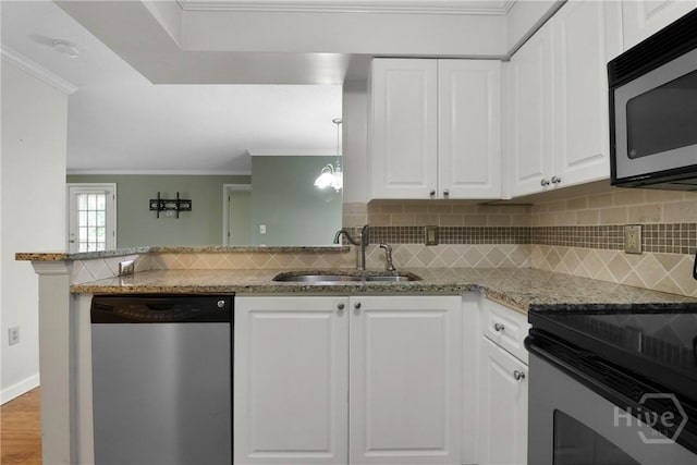 12300 Apache Ave Unit 1212, Savannah, GA 31419 - kitchen with appliances with stainless steel finishes, a sink, backsplash, white cabinetry, and ornamental molding