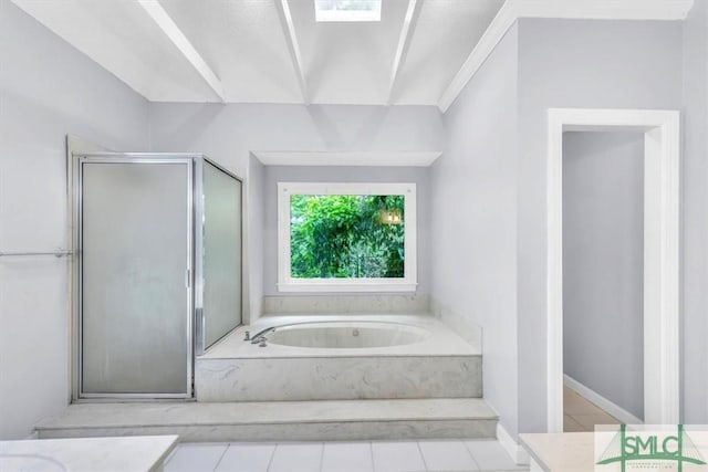 bathroom with a shower stall, a garden tub, tile patterned floors, and vanity
