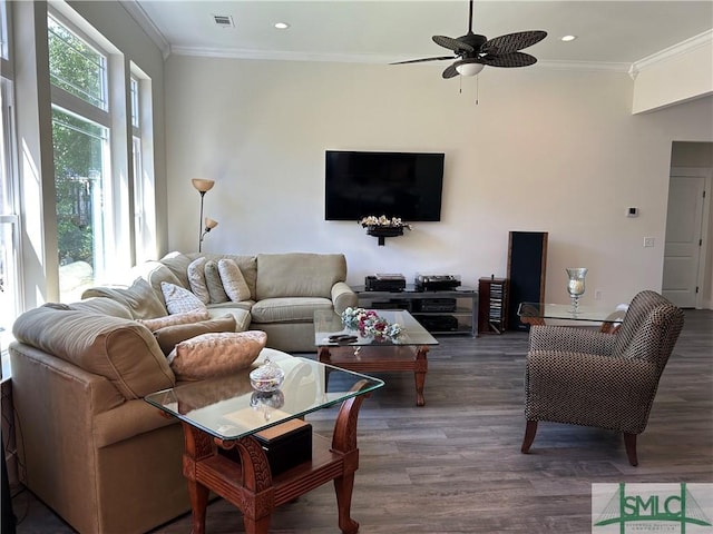 living room featuring crown molding, a ceiling fan, wood finished floors, and visible vents
