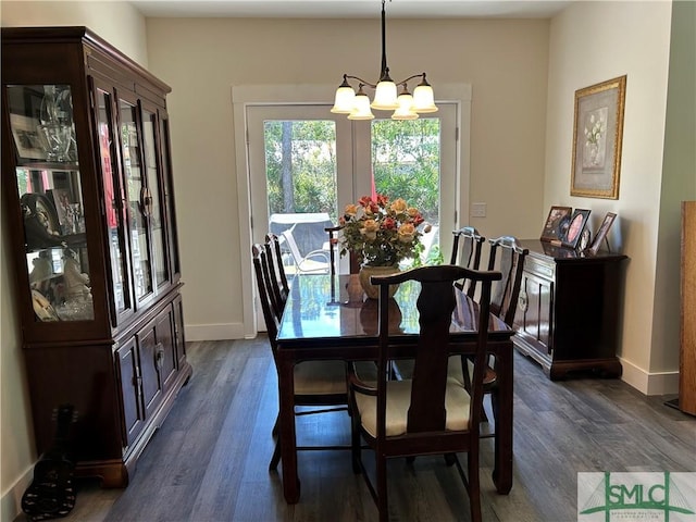 dining room with baseboards, dark wood-style floors, and a notable chandelier