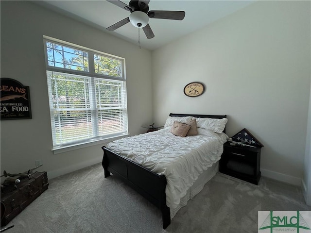 bedroom with carpet floors, baseboards, and a ceiling fan