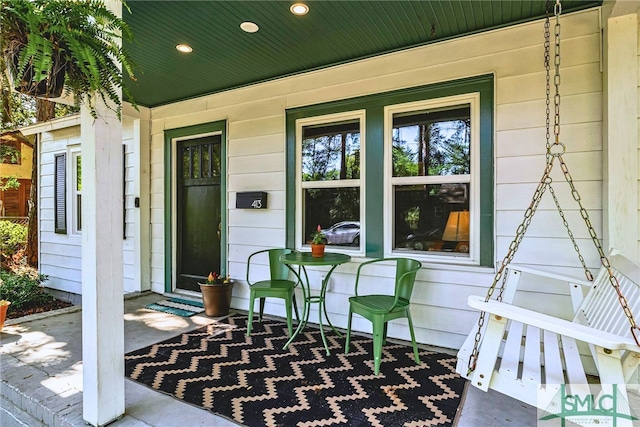entrance to property featuring a porch