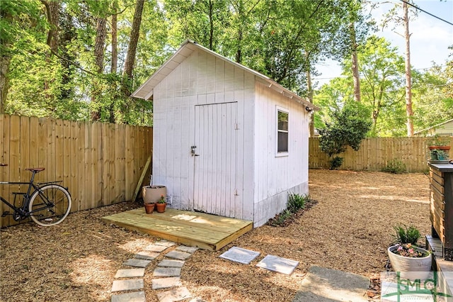view of shed with a fenced backyard
