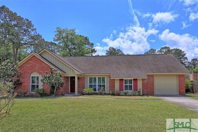 ranch-style house featuring driveway, brick siding, a front yard, and a garage