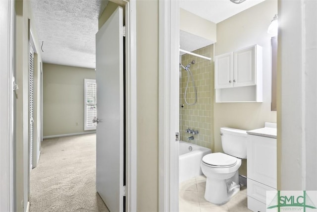 bathroom with shower / washtub combination, toilet, vanity, baseboards, and a textured ceiling
