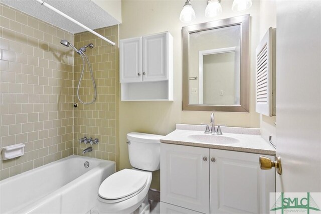 full bathroom with toilet, vanity, and shower / bathing tub combination