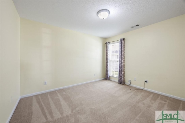 153 Fire Thorn Ln, Pooler, GA 31322 - carpeted empty room with baseboards, a textured ceiling, and visible vents