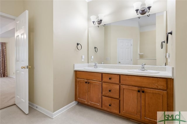 153 Fire Thorn Ln, Pooler, GA 31322 - bathroom featuring a sink, baseboards, and double vanity