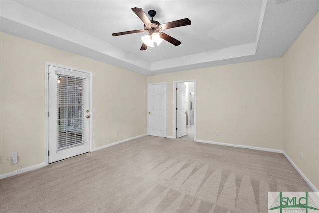 153 Fire Thorn Ln, Pooler, GA 31322 - unfurnished room with a raised ceiling, baseboards, a ceiling fan, and light colored carpet