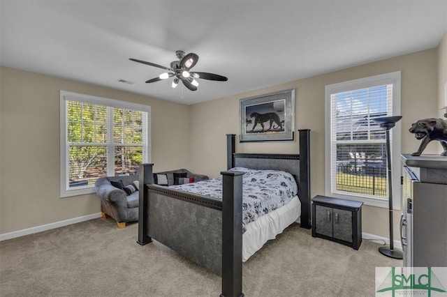 bedroom with baseboards, multiple windows, and visible vents