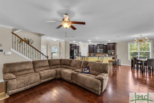 living room featuring baseboards, stairway, a ceiling fan, and dark wood-style floors