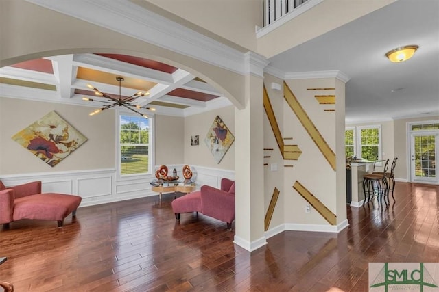 playroom featuring hardwood / wood-style flooring, a wealth of natural light, coffered ceiling, and beamed ceiling