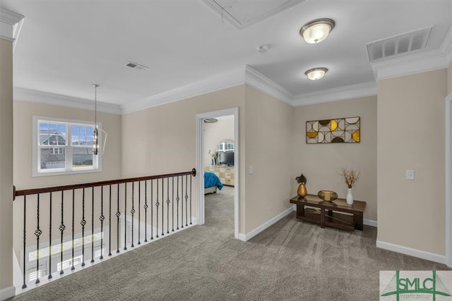 hall featuring attic access, crown molding, and visible vents