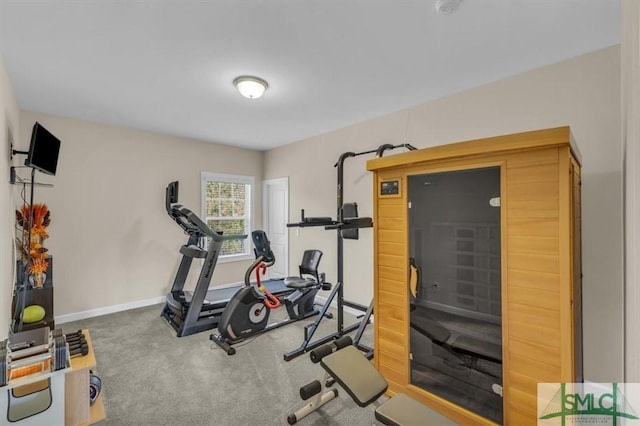 workout room with carpet flooring and baseboards
