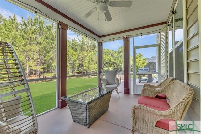 sunroom with a ceiling fan