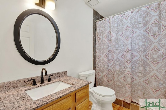 12 Carpenter Rd, Tybee Island, GA 31328 - full bathroom featuring vanity, a shower with shower curtain, and wood finished floors