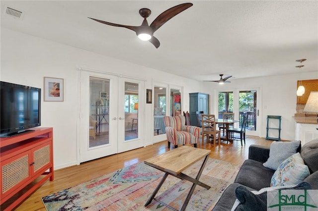 12 Carpenter Rd, Tybee Island, GA 31328 - living area featuring french doors, ceiling fan, and wood finished floors