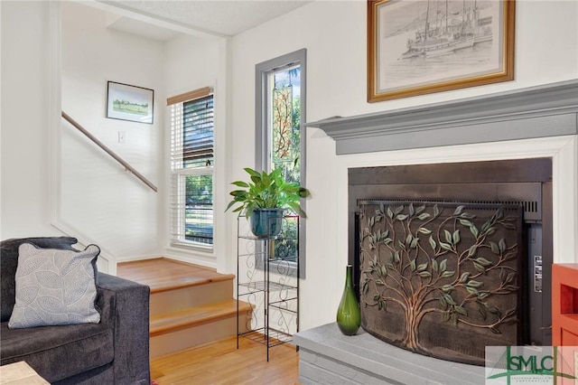 12 Carpenter Rd, Tybee Island, GA 31328 - sitting room with wood finished floors and a fireplace