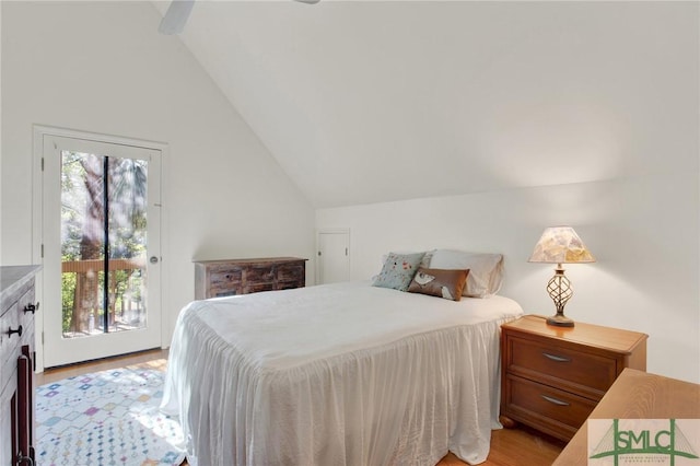 12 Carpenter Rd, Tybee Island, GA 31328 - bedroom with access to outside, vaulted ceiling, and light wood-style flooring