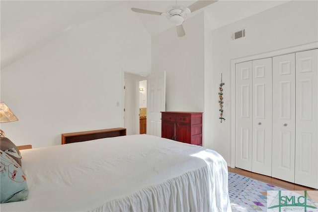 12 Carpenter Rd, Tybee Island, GA 31328 - bedroom featuring high vaulted ceiling, a closet, wood finished floors, and a ceiling fan