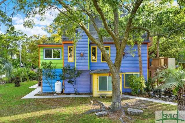 12 Carpenter Rd, Tybee Island, GA 31328 - view of front of home featuring a front yard