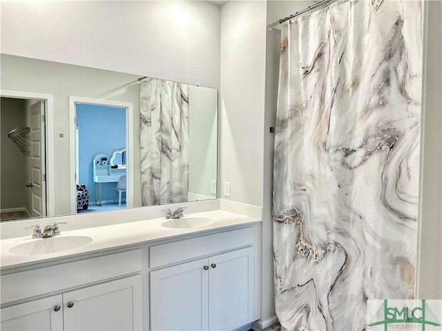 bathroom featuring double vanity and a sink