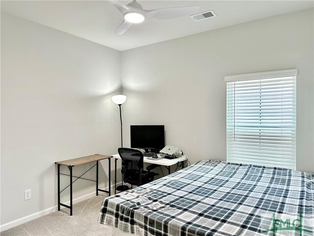 bedroom with a ceiling fan, baseboards, visible vents, and carpet