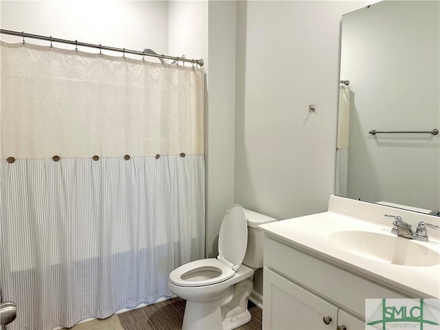 full bath with vanity, tile patterned floors, toilet, and curtained shower
