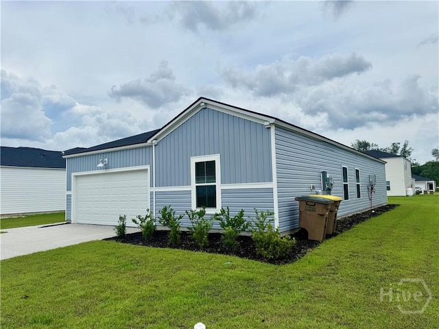 262 Lillian St, Rincon, GA 31326 - view of side of property featuring board and batten siding, concrete driveway, a yard, and an attached garage