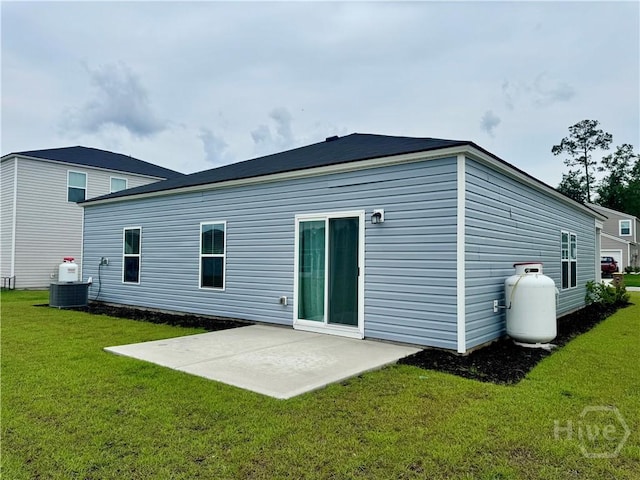 262 Lillian St, Rincon, GA 31326 - rear view of property with a patio, a lawn, and cooling unit