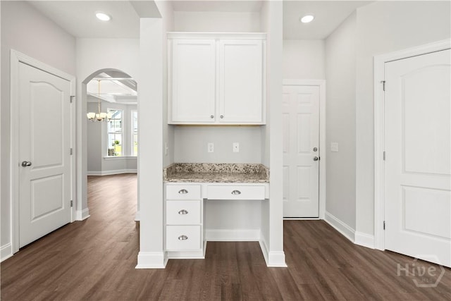 31 Oakmont Dr, Guyton, GA 31312 - unfurnished office featuring a chandelier, dark wood-style floors, built in desk, recessed lighting, and arched walkways