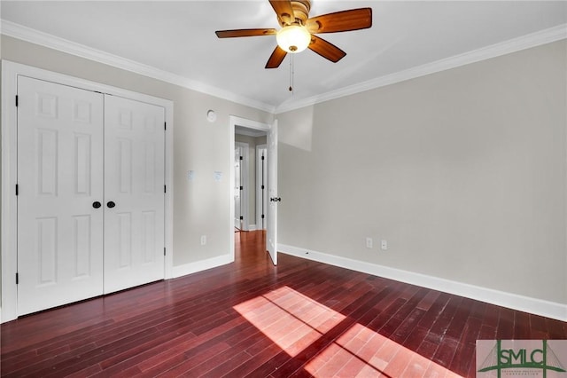836 E Park Ave, Savannah, GA 31401 - unfurnished bedroom featuring wood finished floors, baseboards, crown molding, a closet, and ceiling fan