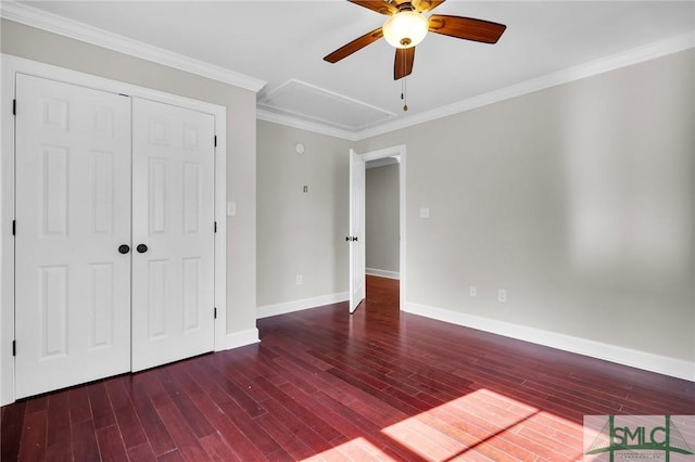 836 E Park Ave, Savannah, GA 31401 - unfurnished bedroom with wood finished floors, baseboards, attic access, a closet, and ornamental molding