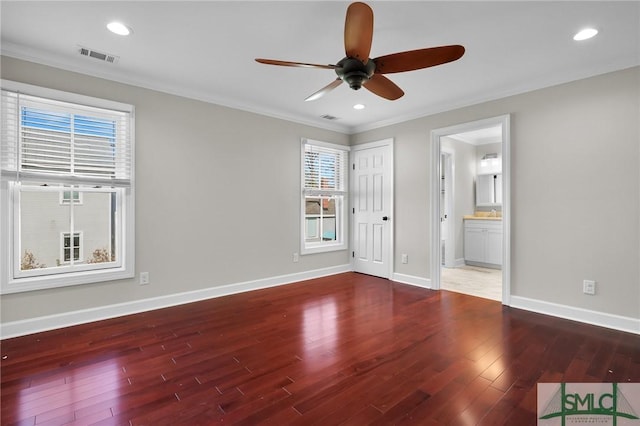 836 E Park Ave, Savannah, GA 31401 - unfurnished bedroom featuring wood finished floors, crown molding, baseboards, ensuite bathroom, and recessed lighting