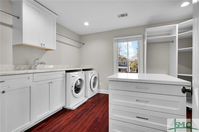836 E Park Ave, Savannah, GA 31401 - laundry room with washer and clothes dryer, cabinet space, dark wood-style flooring, recessed lighting, and baseboards