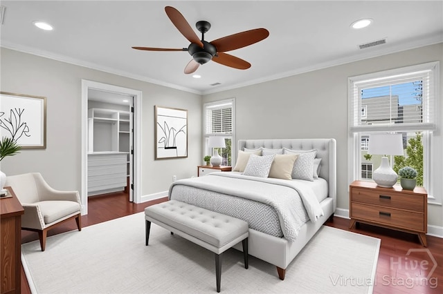 836 E Park Ave, Savannah, GA 31401 - bedroom featuring dark wood-style flooring, baseboards, recessed lighting, ornamental molding, and a spacious closet