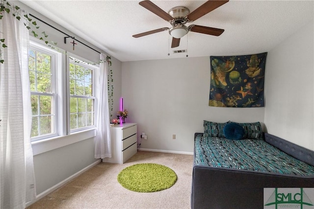 bedroom with visible vents, carpet flooring, baseboards, and multiple windows