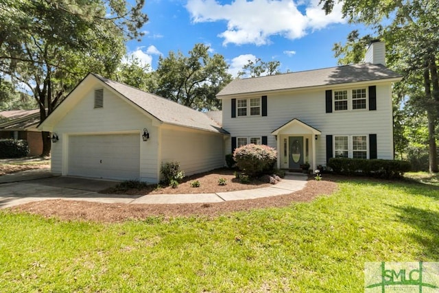 colonial home with a garage, a chimney, a front lawn, and concrete driveway
