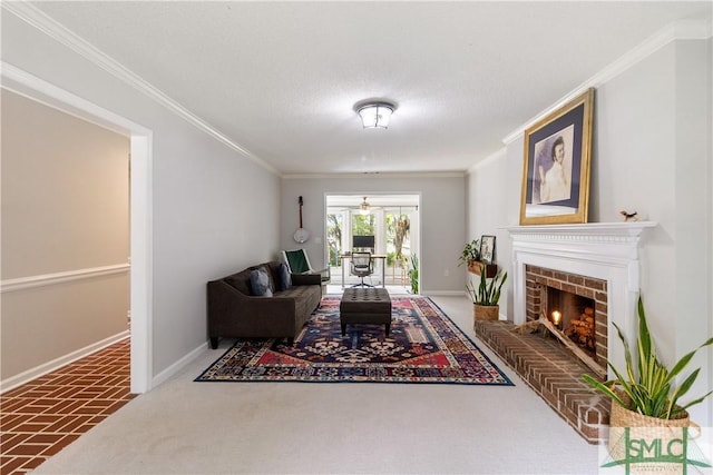 living room featuring baseboards, ornamental molding, and a fireplace