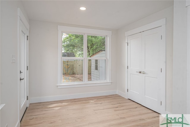 interior space with recessed lighting, baseboards, and light wood-type flooring