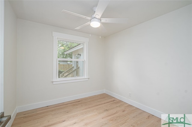 unfurnished room with wood finished floors, baseboards, and ceiling fan